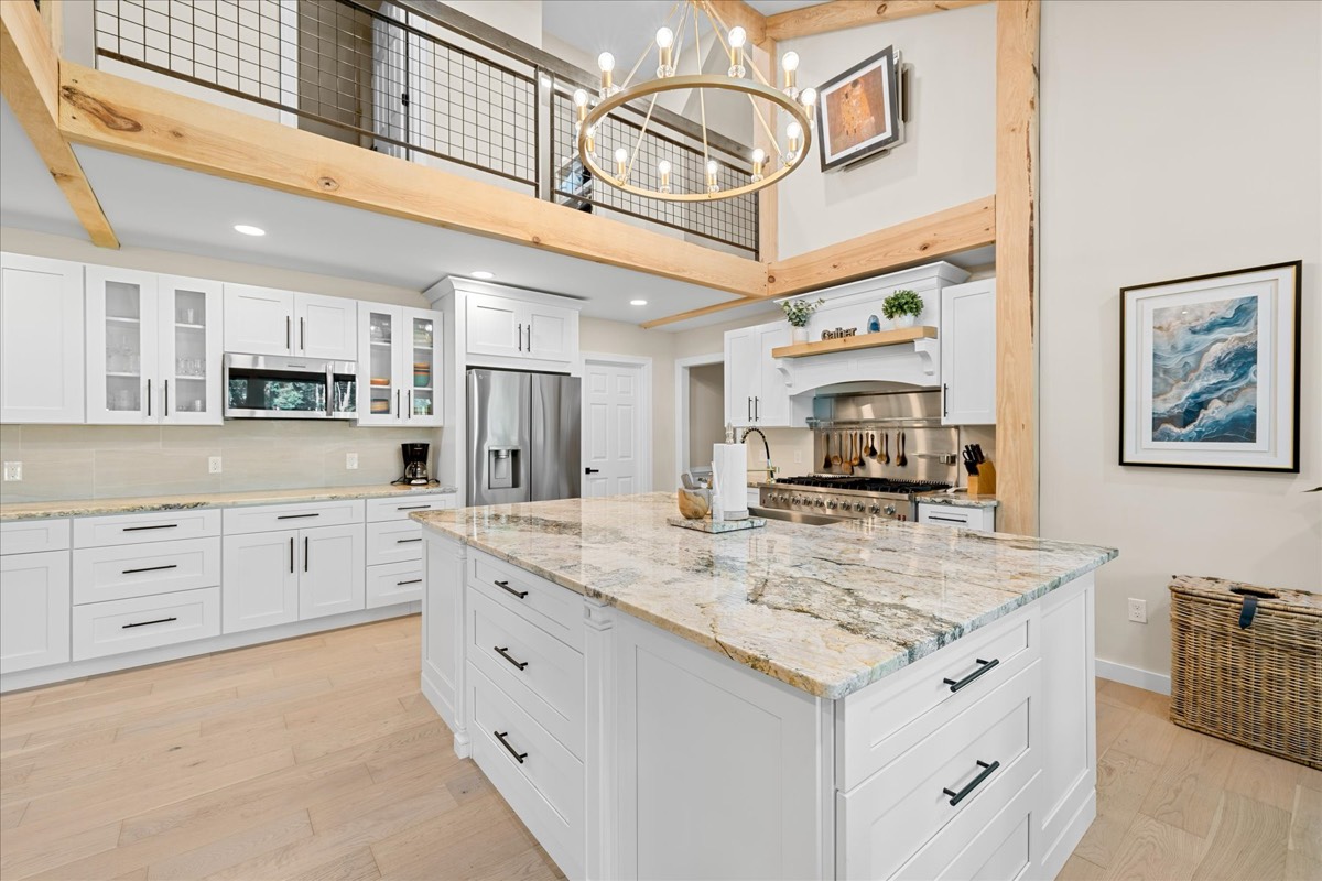 Kitchen with white cabinets and stainless appliances